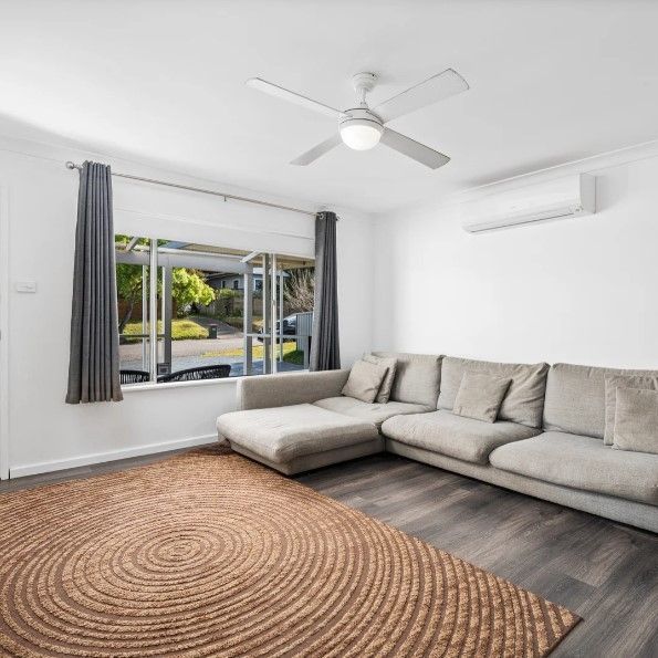 Family home with multiple living zones and large fenced yard - Photo 1