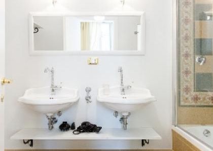 Center-Historic Jewish Quarter: Elegant apartment situated in beautiful Palazzo Nobiliare. Entrance, spacious living with original wood frescoed ceilings, large modern dining and kitchen, 4 bedrooms, 4 Baths, small terrace. #1527