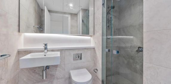 Exceptional Four-Bedroom Apartment with Panoramic Water & City Views - Photo 2