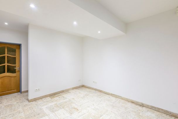 Ruim en energiezuinig gelijkvloers appartement op wandelafstand van de Schelde - Photo 1