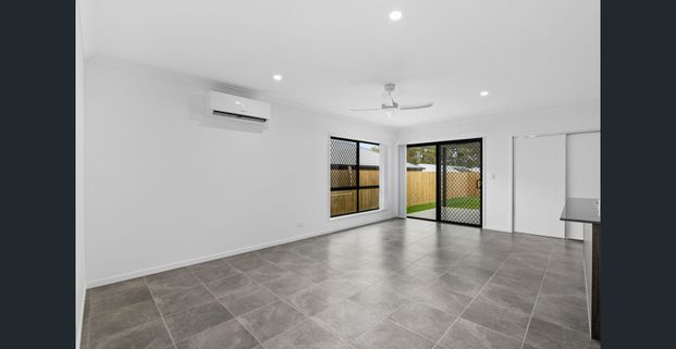 Experience Modern Luxury at its Finest: Stunning Rental Property in Logan Reserve - Photo 1