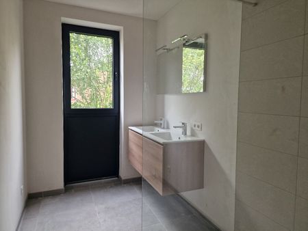 Nieuwbouwappartement op eerste verdieping met 2 slaapkamers, autostaanplaats en kelder - Photo 3