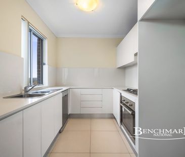 Modern Two-Bedroom Apartment with District Views - Photo 6