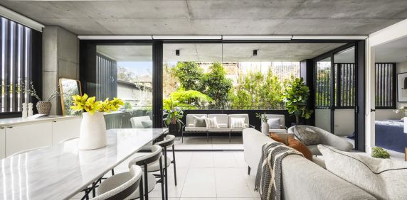 Stylish Coastal Apartment with Garden Outlook - Photo 2
