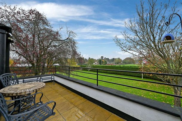 A beautifully presented two bedroom apartment in a gated and private with views over fields an off-street parking. - Photo 1