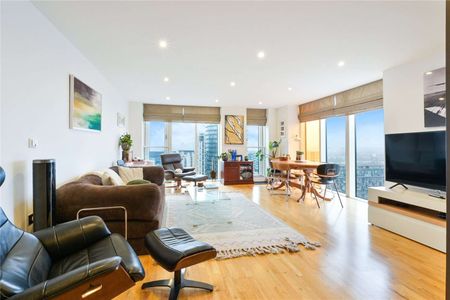 This luxurious 2-bedroom, 2-bathroom 1046sqft apartment on the higher floors of Ability Place, E14, offers contemporary living in one of London's most desirable locations. - Photo 3