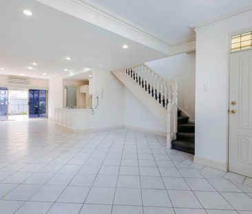 TRENDY TOWNHOUSE IN SECURE LOCATION! - Photo 1