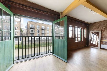 Set within a characterful period building, the property seamlessly blends industrial charm with contemporary living. - Photo 2