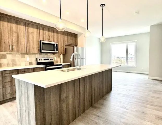 Near LRT Brand New 3B Townhouse in Shawnee Slopes | Shawnee Sq SW, Calgary - Photo 1