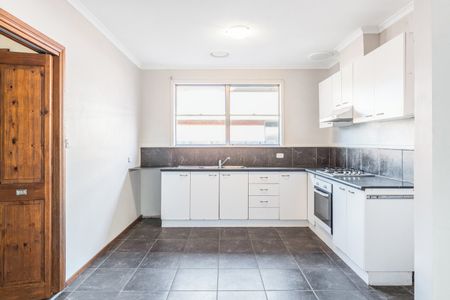 Spacious Three-Bedroom Home in Prime Location - Photo 3