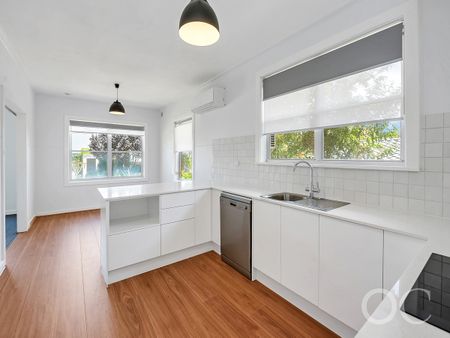 Open the door to coastal living with a sunlit deck retreat - Photo 2