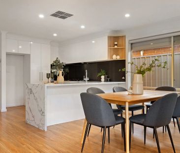 Modern Comfort and Style in a Beautifully Renovated Family Home - Photo 4