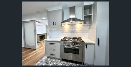 STEP INSIDE THIS BEAUTIFULLY RENOVATED HOME - Photo 4