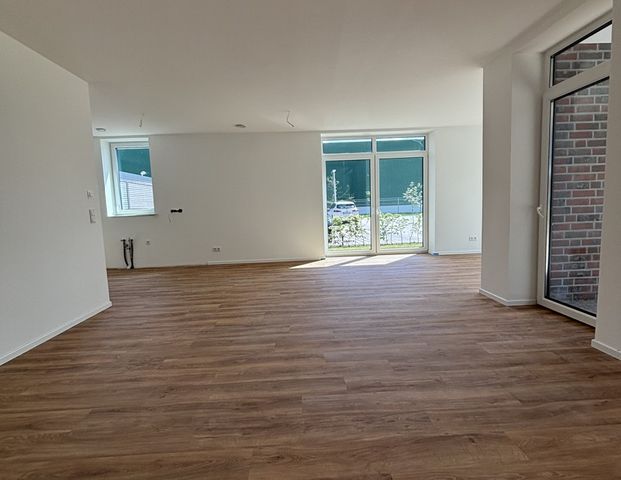 Sonnige Erdgeschosswohnung am Norder Tor mit großer Terrasse zur Miete! - Foto 1