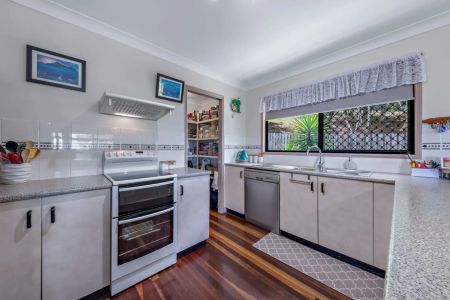 Coastal Living with Coral Sea Views – Spacious 4 Bedroom Home - Photo 2