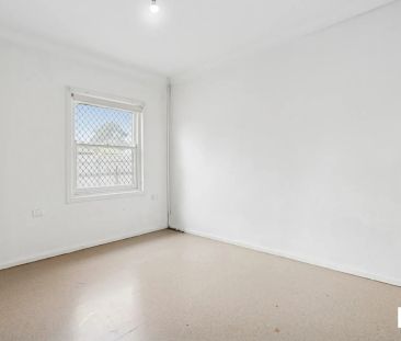 Comfortable 3-Bedroom Home with Spacious Yard in a Convenient Location - Photo 3