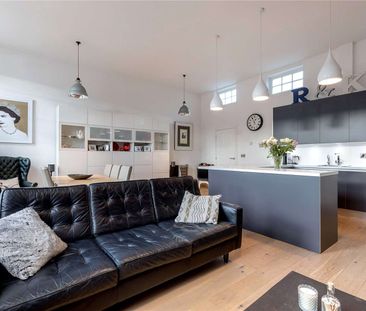 A contemporary two-bedroom apartment with private allocated parking... - Photo 2