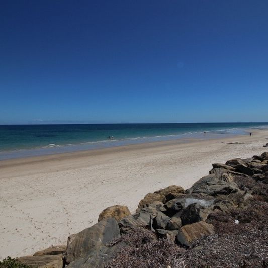 Open the Door To Beachside Bliss and Family-Friendly Living - Photo 1