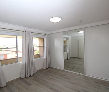 MODERN APARTMENT OFFERING COMFORT, SPACE & UNBEATABLE CONVENIENCE - Photo 1