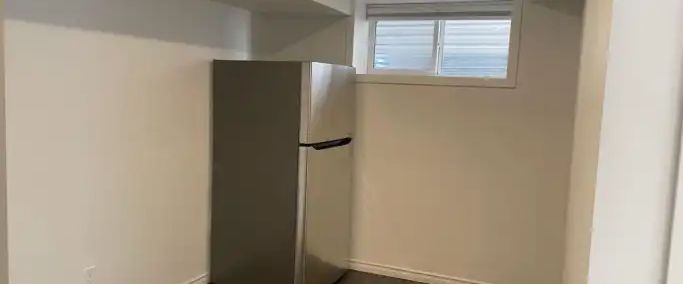 Cozy 1 bed + den legal basement suite | 86 NolanLake Cove Northwest, Calgary - Photo 1