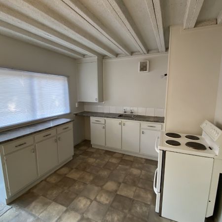 This tidy downstairs unit offers one living area, one bedroom and a bathroom with the laundry included. - Photo 3
