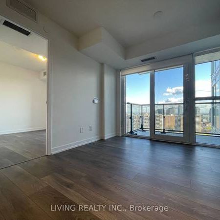 Feels brand new floor to ceiling windows + den! - Photo 4