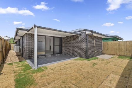 Modern Family Home with Fenced Backyard - Photo 3