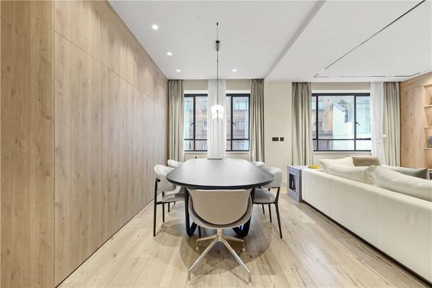 Finished to a high standard, this furnished apartment is located within a sought-after portered building on the prestigious Portland Place in Marylebone. - Photo 1