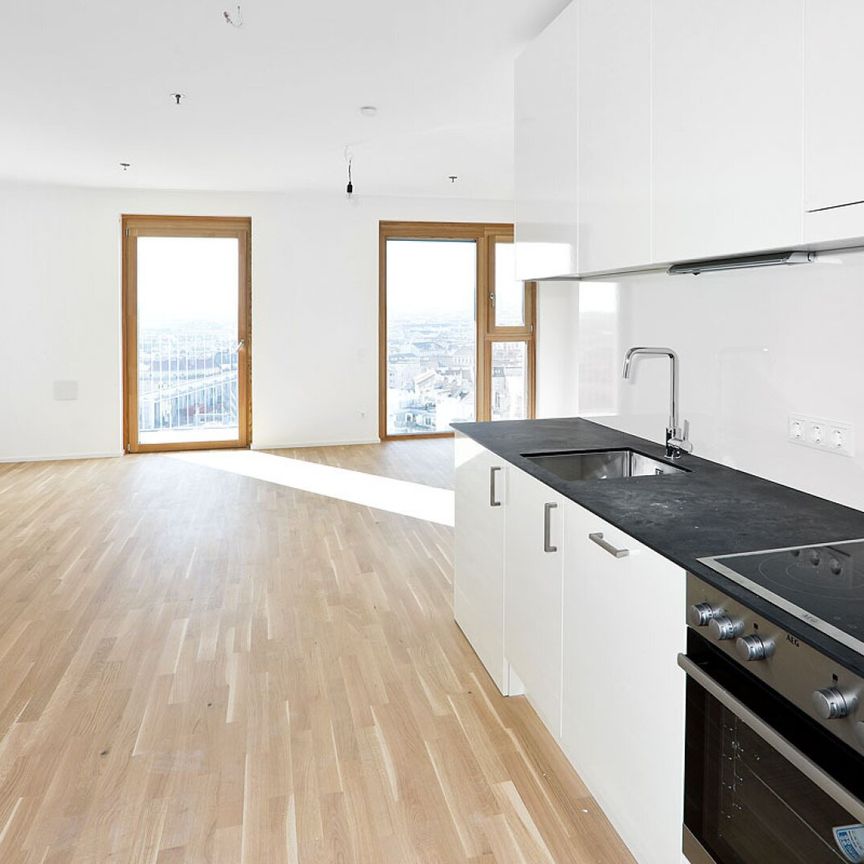 Sonnwendviertel: 1-Zimmer-Wohnung mit Balkon im 19. OG – Fitnessraum, Co-Working & Rooftop-Terrasse inklusive! - Photo 1