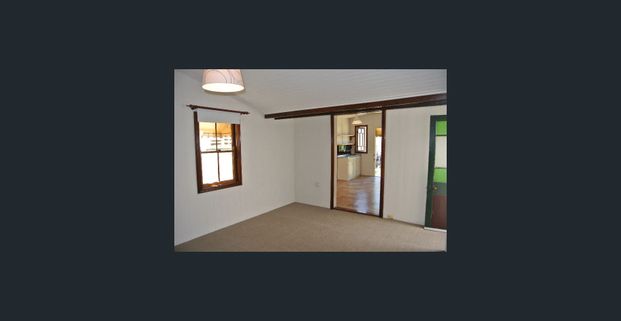 Two Bedroom Home in Central Location + Lawn Maintenance Included! - Photo 1