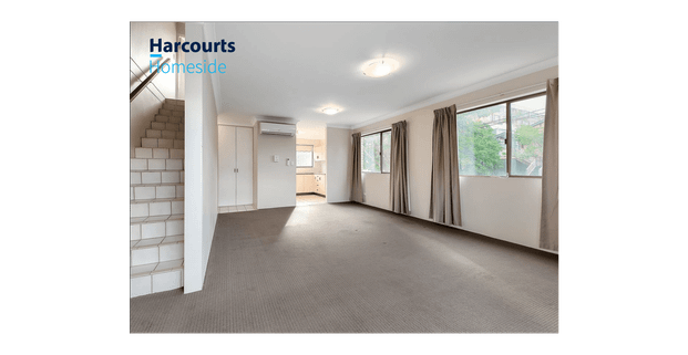 Spacious Townhouse Style Living on North East Corner - Photo 1