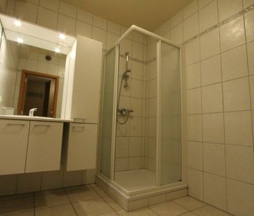 Gelijkvloers appartement met 1 slaapkamer - ondergrondse staanplaats en kelderberging - Foto 1