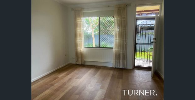 A well presented unit perfectly positioned close to local shops, cafés, and convenient transport options for a quick and easy commute into the city. - Photo 1