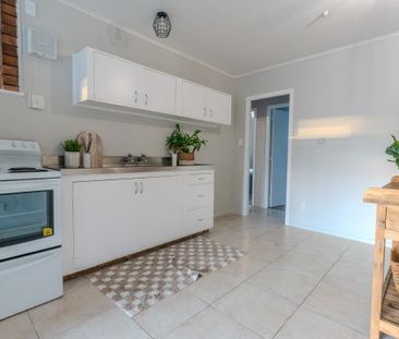 This newly renovated 2-bedroom unit offers modern, low-maintenance ... - Photo 1