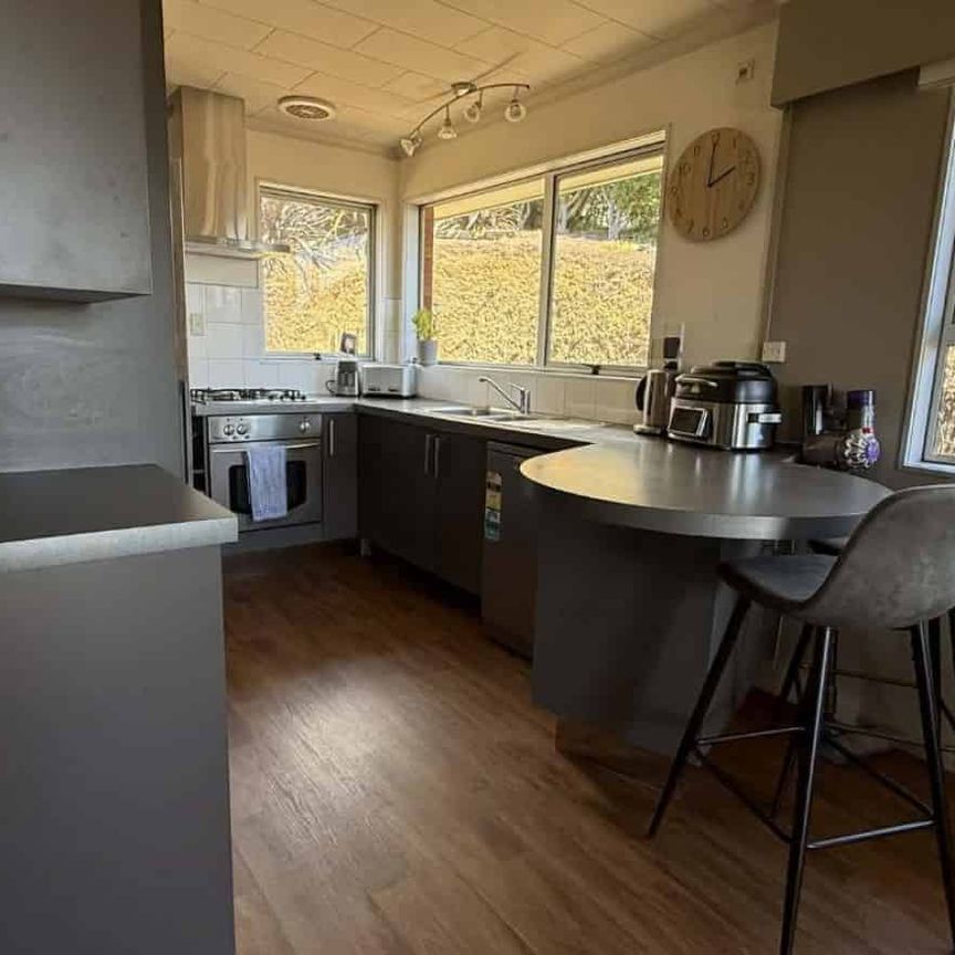 Sunny Two-Level Three Bedroom Home - Photo 1