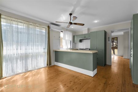 Charming Three-Bedroom Home - Photo 3