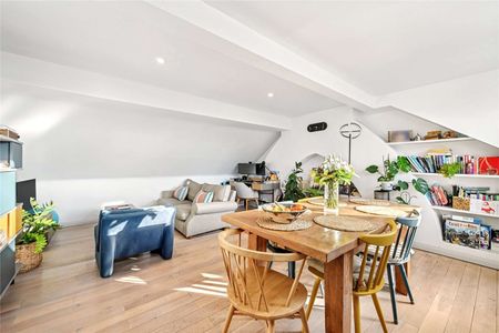 A bright and immaculately presented two-bedroom/two-bathroom top floor apartment, with a small balcony and first floor entrance, within a stunning Victorian building on a tree-lined street. - Photo 3