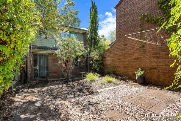 Charming Townhouse with Renovated Appeal and Original Charm - Photo 1