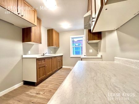 Completely Renovated 4 Bedroom 1 Bathroom Main Floor Unit - Photo 3