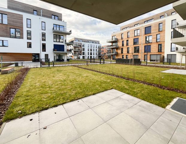 Wohlfühloase: Moderne 1,5-Zimmer-Wohnung mit Terrasse und Garten in exklusiver Stadtvilla - Photo 1