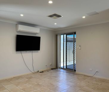 Charming, Secure 4-Bedroom, 2-Bathroom Home, Featuring Triple Garag... - Photo 3