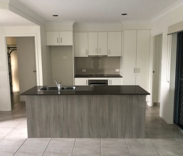 Fully fenced low maintenance yard - Photo 3