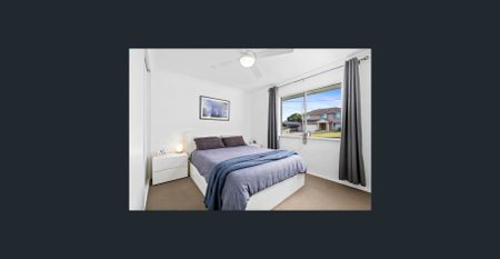 Family home with multiple living zones and large fenced yard - Photo 5