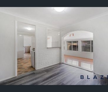 Comfortable 4-Bedroom Home Close to All Amenities! - Photo 3