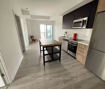 2 bed/2 bath Just Off The Queensway | 25 Neighbourhood Lane, Toronto - Photo 1