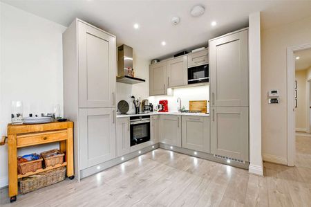 A centrally located two bedroom first floor apartment with private roof terrace. - Photo 2