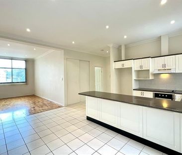 Sun-Filled and Spacious Apartment with Secure Undercover Parking - Photo 1