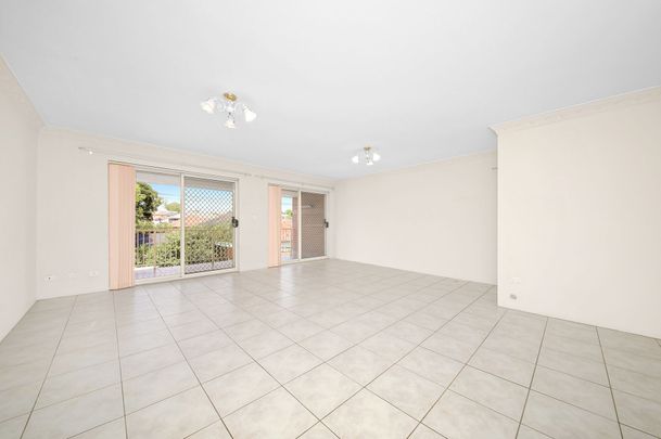 UPDATED MODERN UNIT IN POPULAR SECURITY COMPLEX - Photo 1