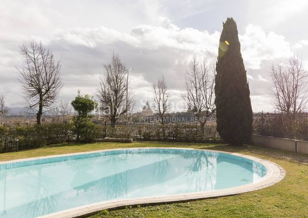Apartment with garden and communal swimming pool