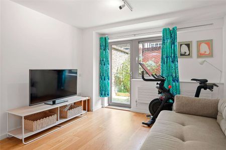 A modern one bedroom apartment with a private patio garden. - Photo 5